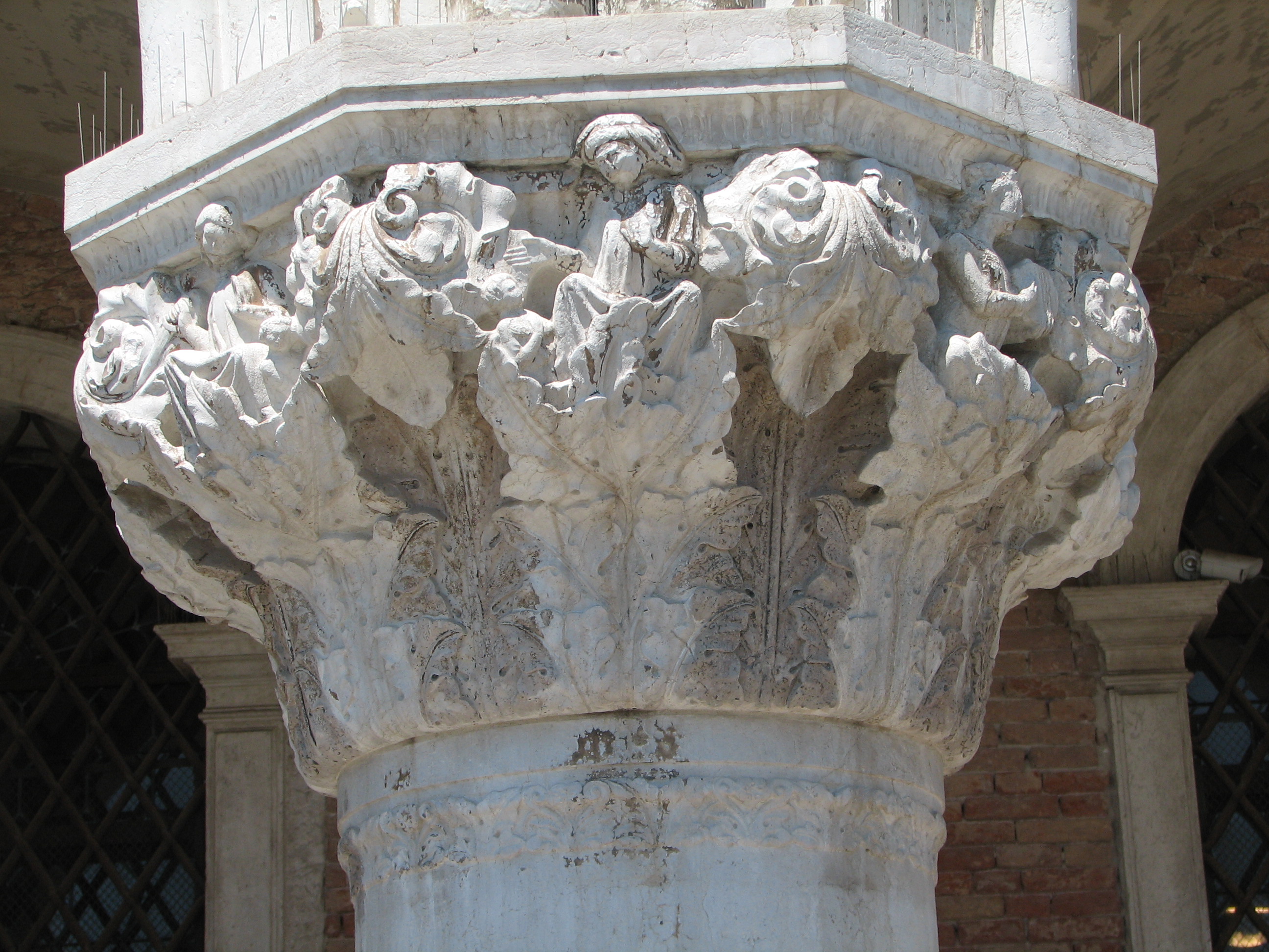 Detail of 12th capital in its current state Astinecia (Abstinentia), side 8, left; Miseria (Misericordia), side 1, centre; Alacritas, side 2, right