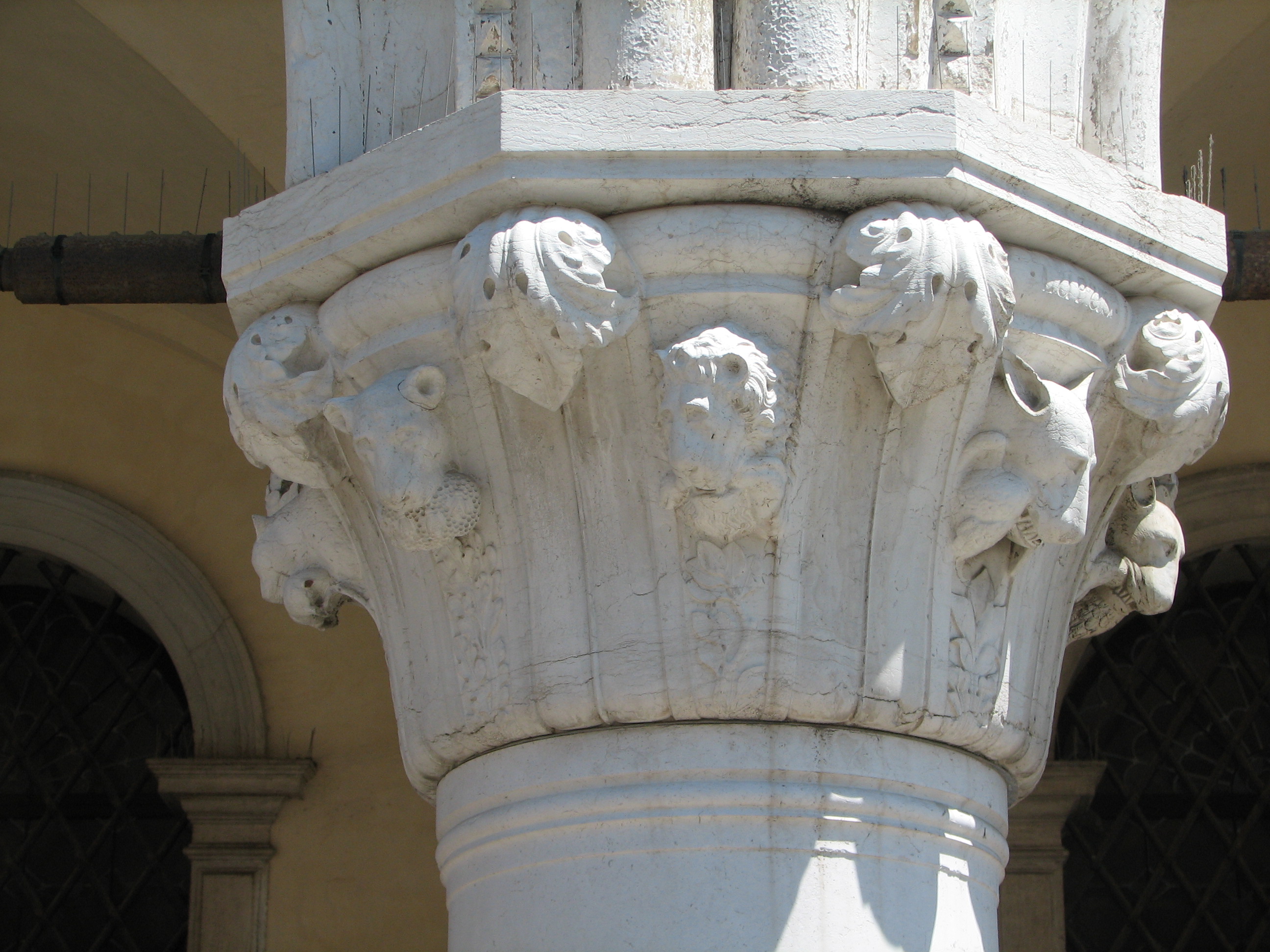 Detail of 1870s copy of 20th capital in its current state Bear with honeycomb and bees, side 8, left; Lion with stags haunch, side 1, centre; Wolf with dead bird, side 2, right