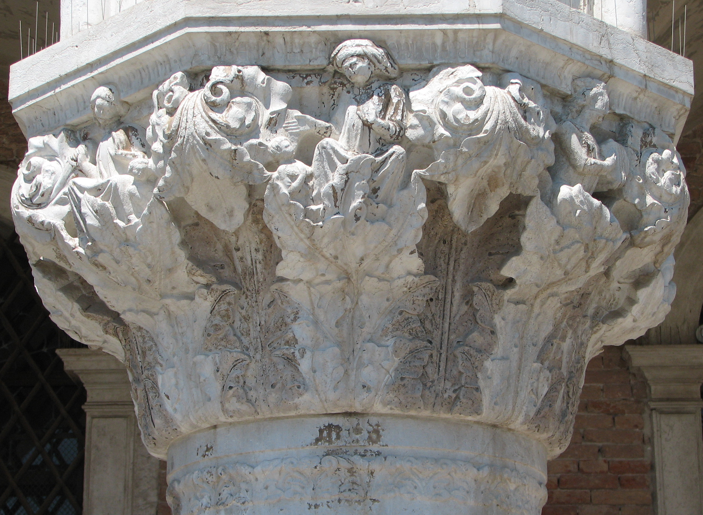 Detail of 12th capital in its current state Astinecia (Abstinentia), side 8, left; Miseria (Misericordia), side 1, centre; Alacritas, side 2, right.