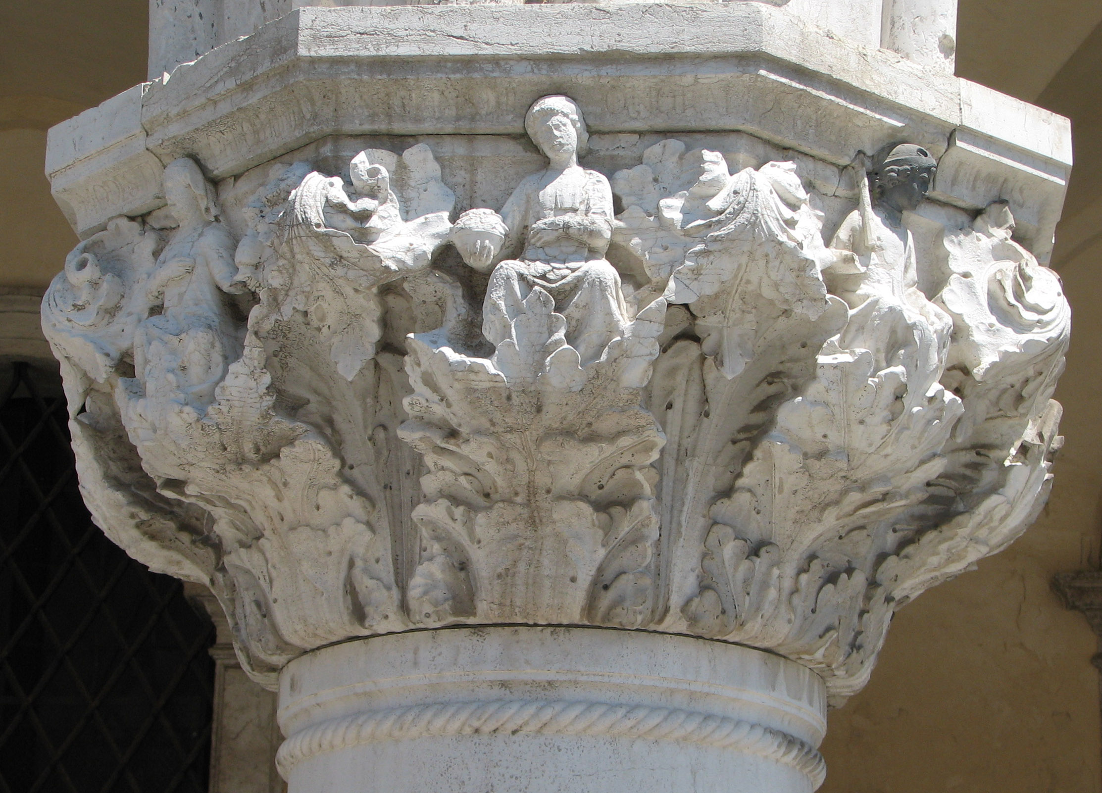 Detail of 28th capital in its current state Modestia, side 8 left; Largitas, side 1, centre; Constantia, side 2, right