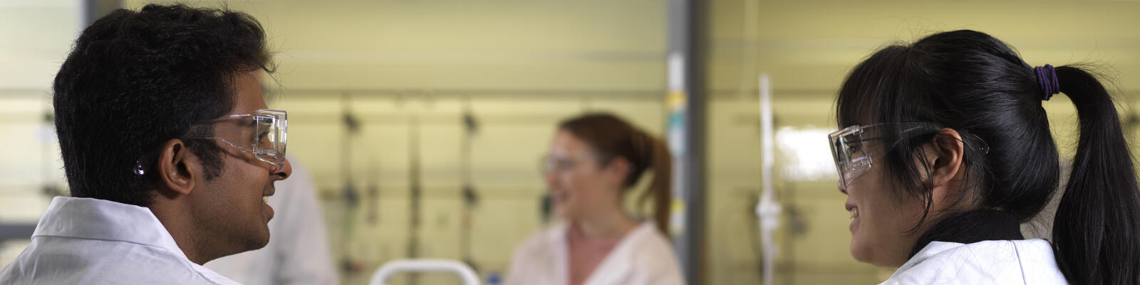 Students at a chemistry lesson smiling