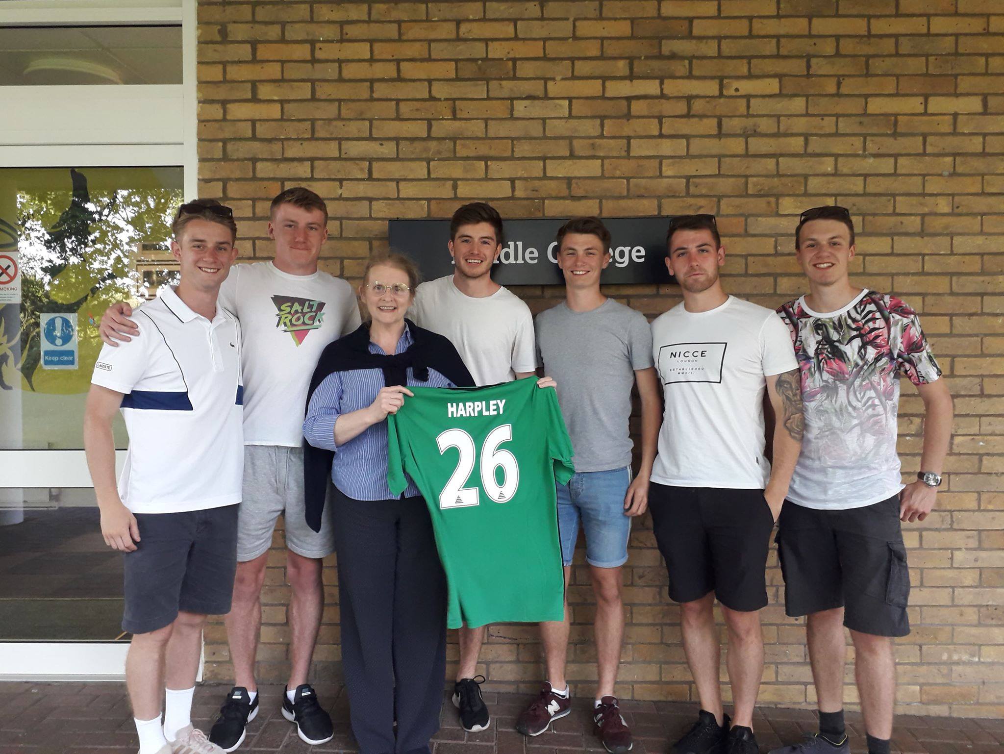 Jill Harpley with shirt presented by football team