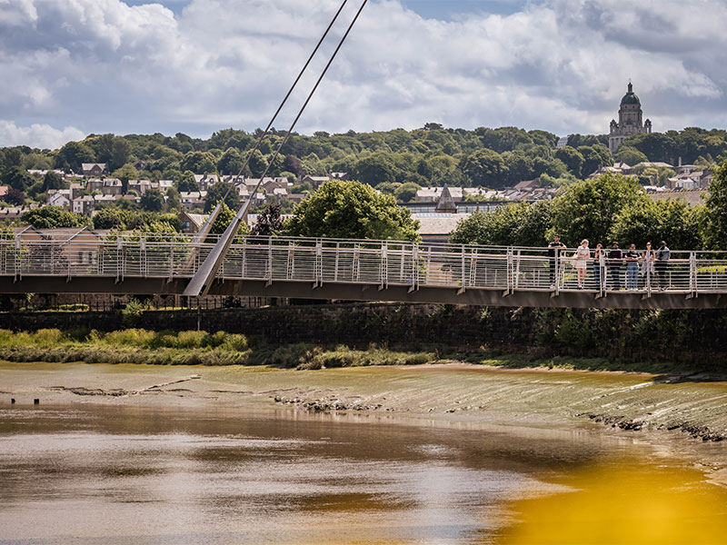 Students walking on the millennium bridge, Lancaster. 