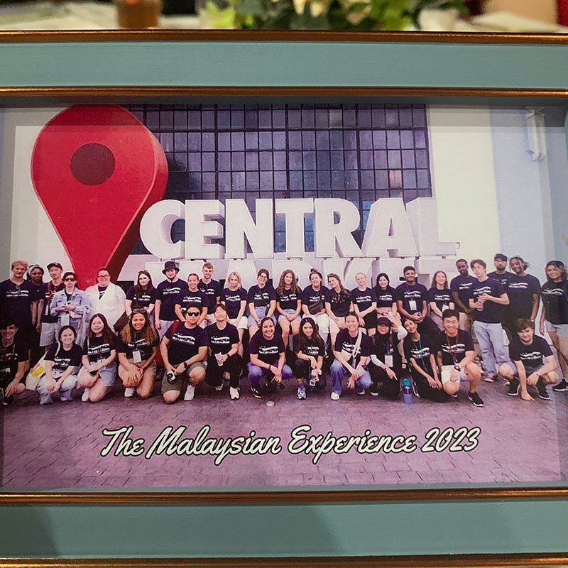 A framed photo of those who attended the Cultural Exchange program to Malaysia.