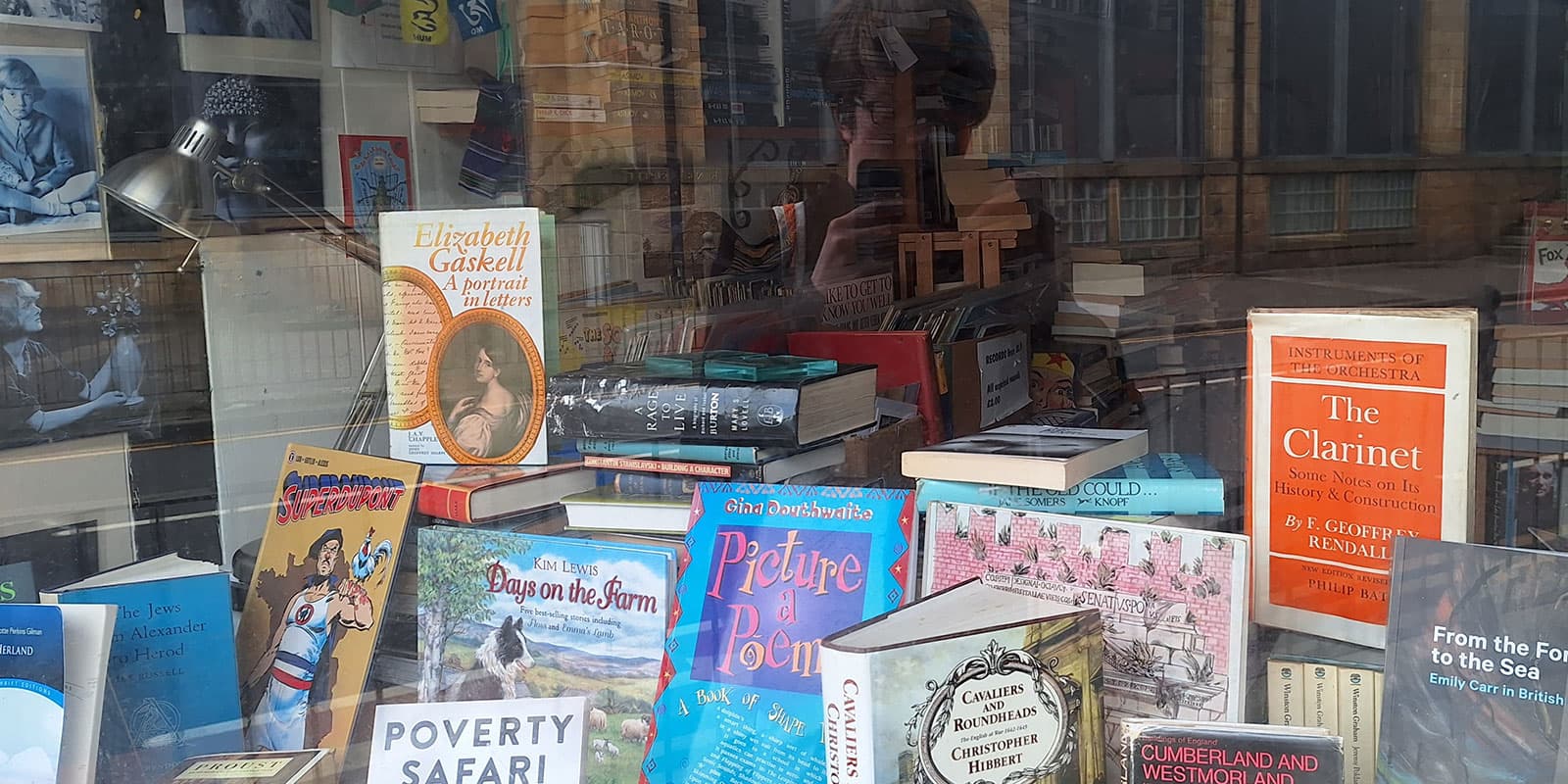 The shop window of Atticus bookshop in Lancaster, several books are in the shop window.