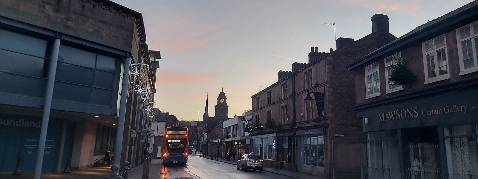 Common Garden Street bus stop, with a sunset in the background.