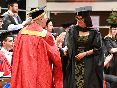 Student Carla at her graduation ceremony for her undergraduate degree.