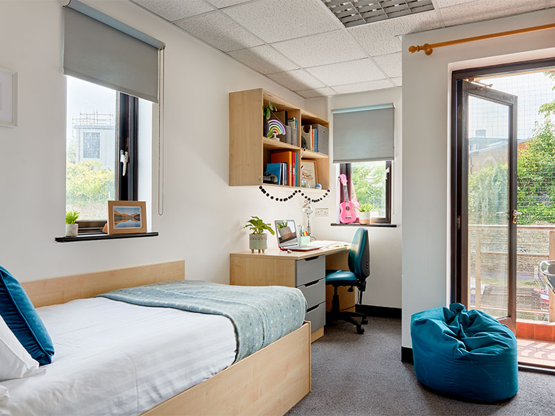 Student accommodation which has a single bed, storage, desk and chair.