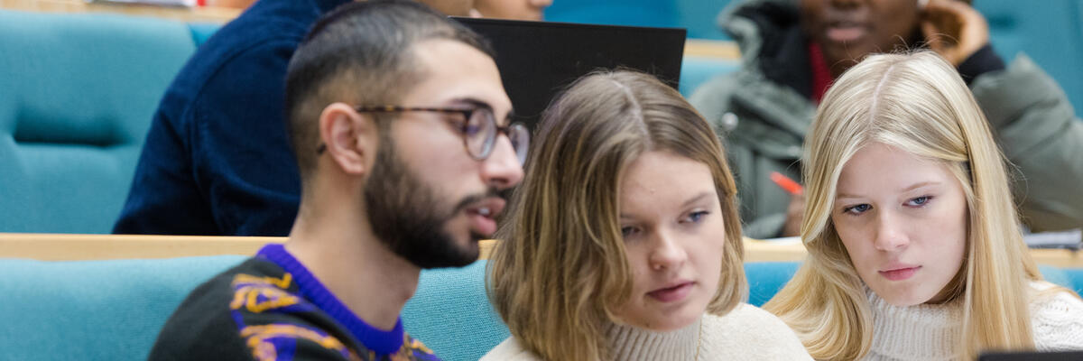 Group of three students in lecture