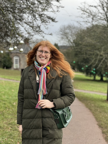 Image of student Lilly-Emma in a park smiling