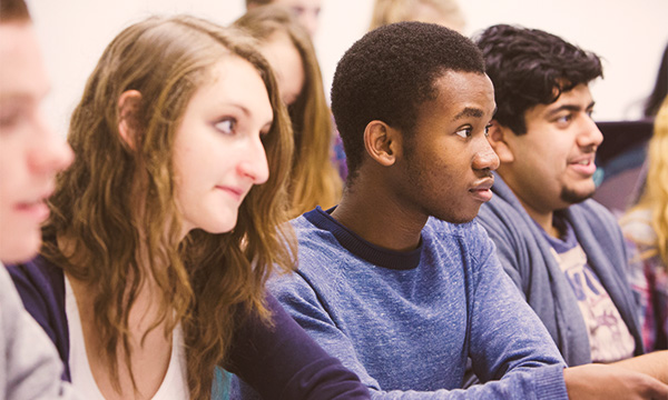 Three students in a lecture.