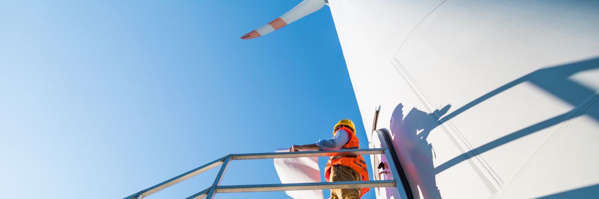 A construction person inspecting a turbine