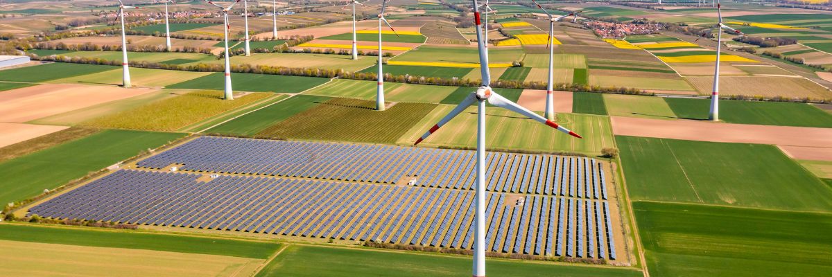 Wind turbines and solar panels in fields