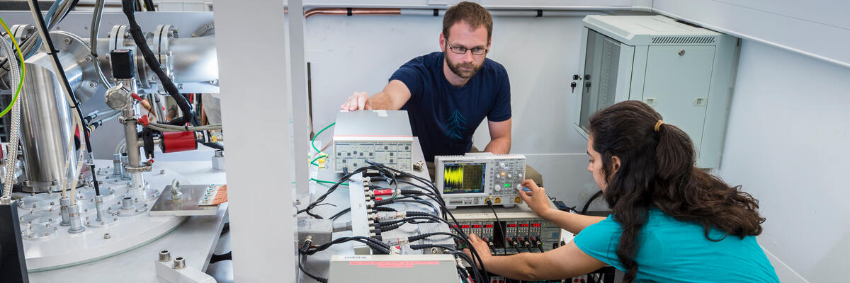 Two staff members working in an Isolab pod