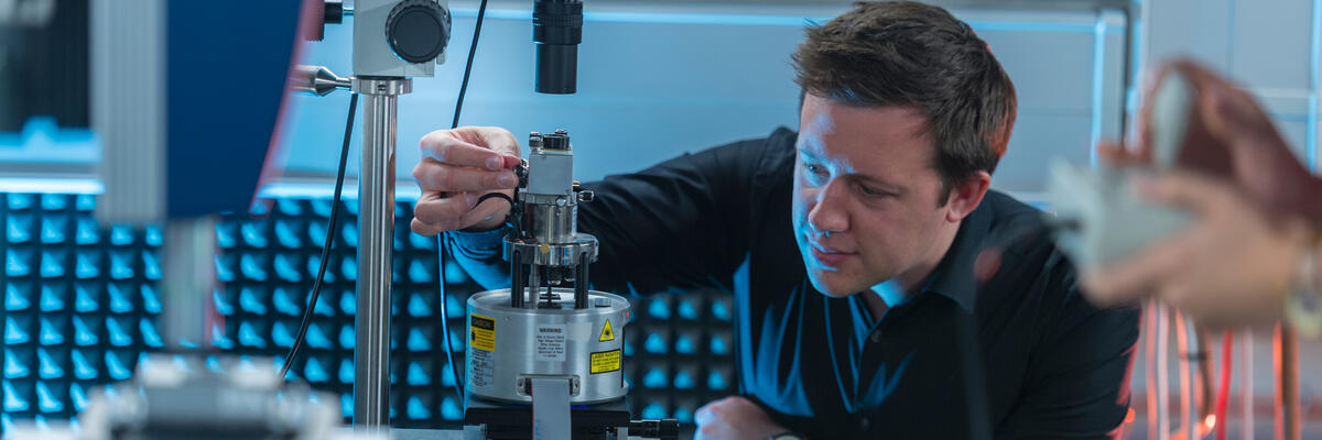 An academic working in an IsoLab pod