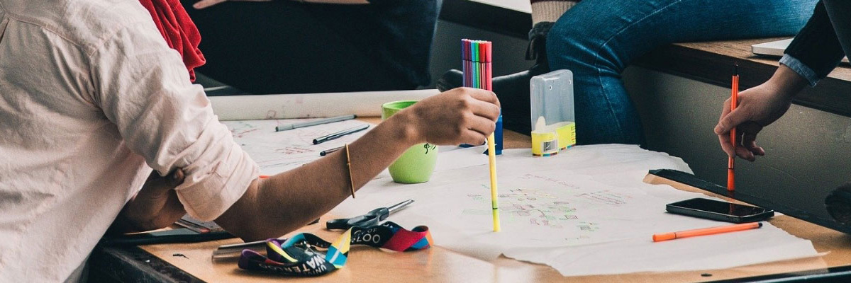 Children colouring in with felt tip pens