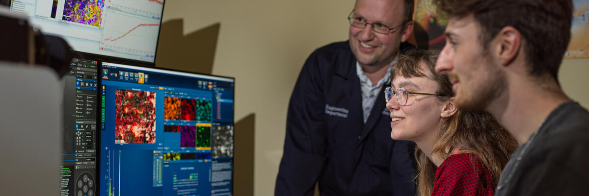 A staff member working on the Scanning Electron Microscope in Engineering