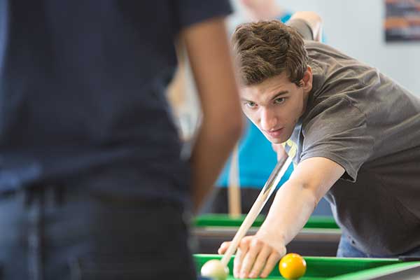 Student playing Pool