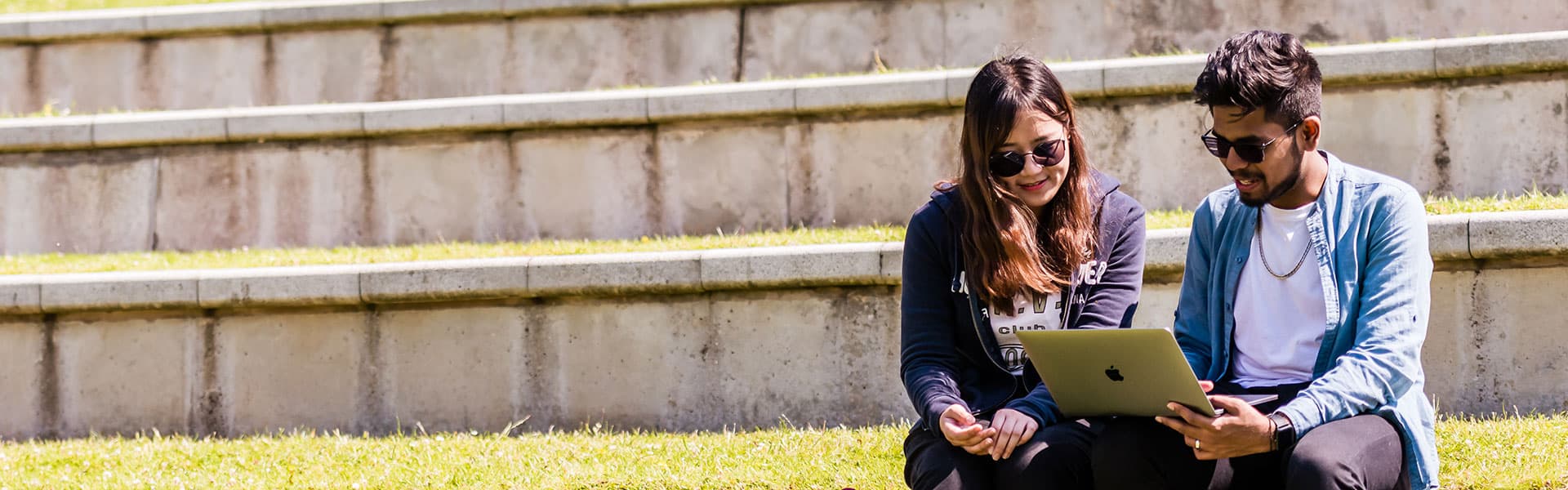 Students sitting on steps chatting