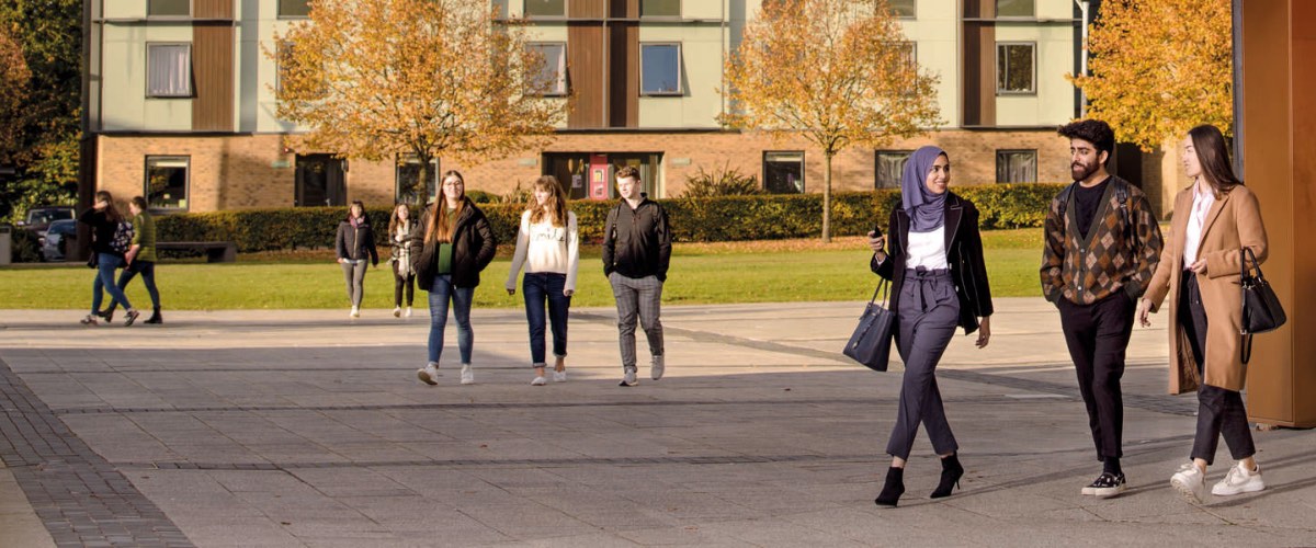 Students walk across the square by the Confucius Centre.