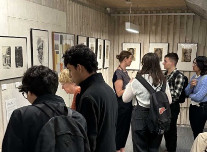 People viewing an exhibition in the library