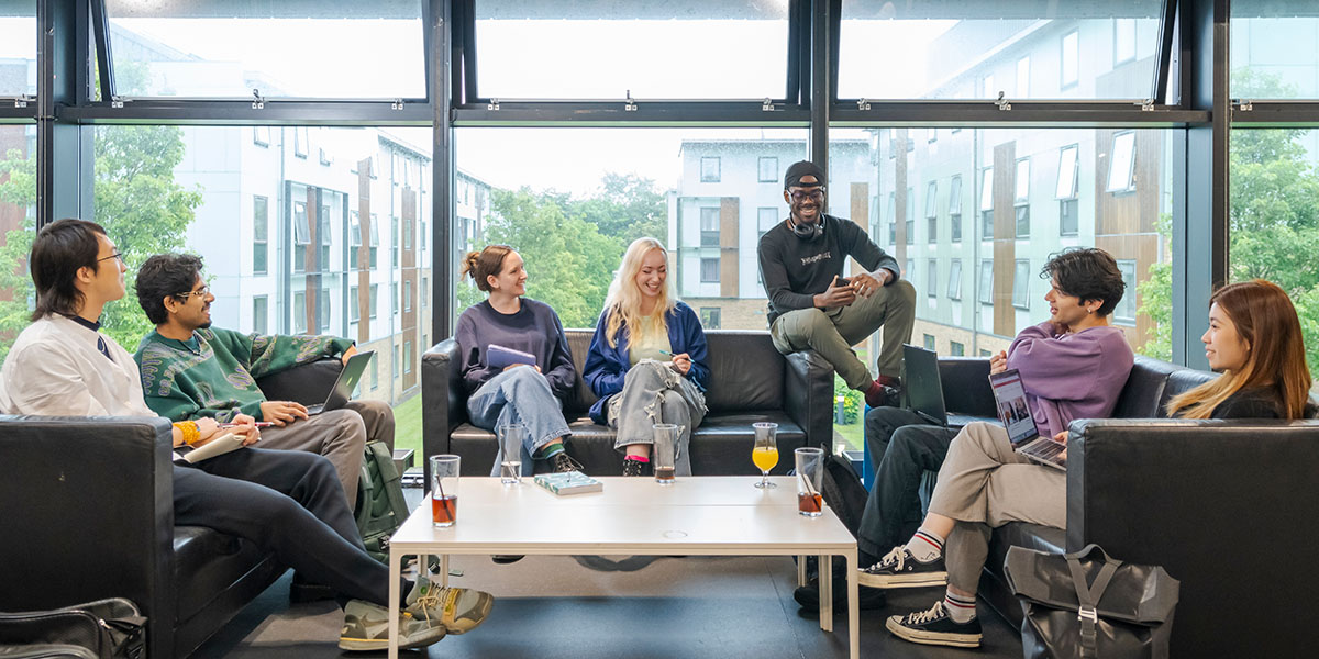 A group of students in a social space at the Lancaster campus