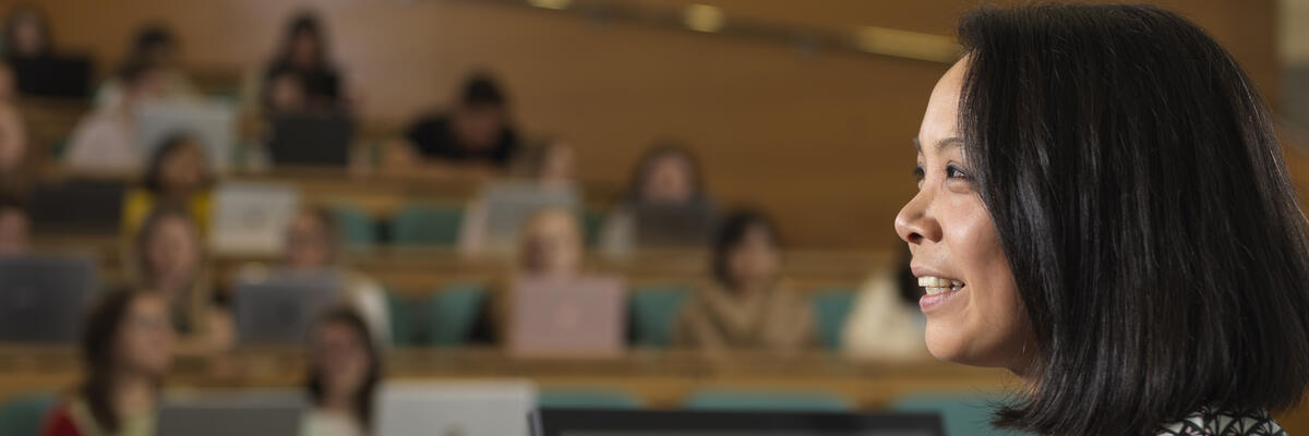 A lecturer delivering a talk