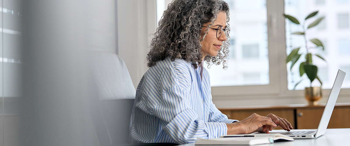 A woman working in a brightly lit office