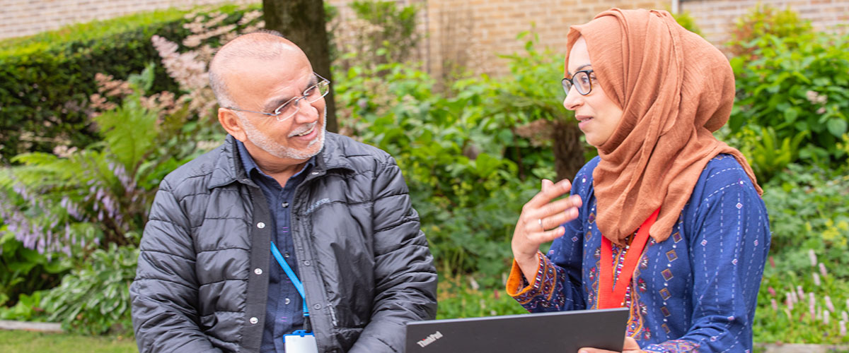 Three Lancaster University staff in conversation