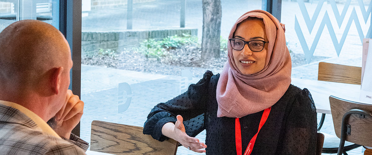 Three Lancaster University staff in conversation