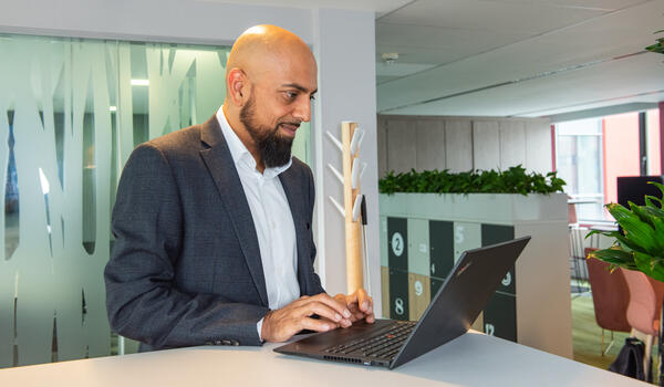 Professional woman working alone with a laptop