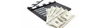 Clapperboard and US dollars