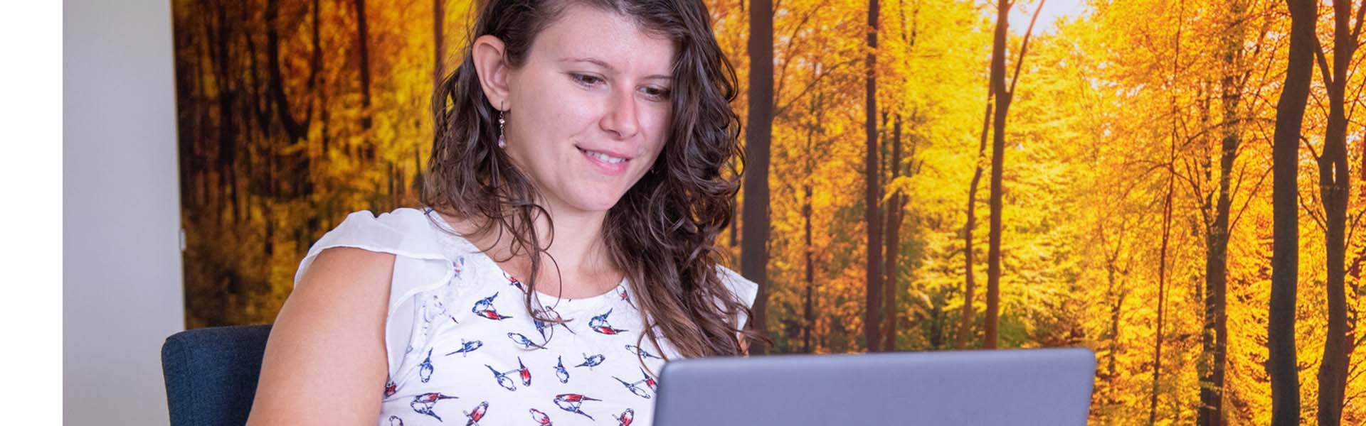 Women sat down working on laptop