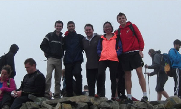 2017 Interns on top of a mountain